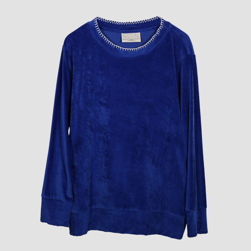 A blue velour nautical themed top hanging on a white background