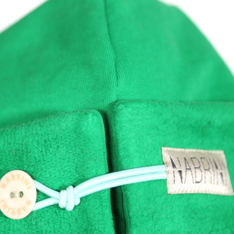 Close up of a green nautical themed beanie