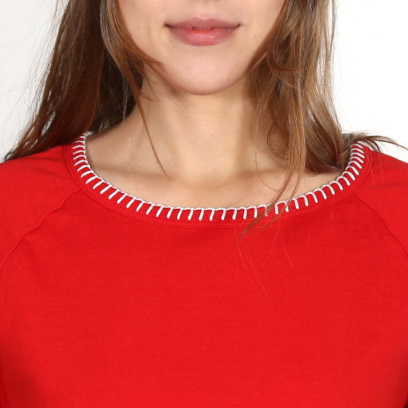 Close up of a woman wearing a red nautical themed crew neck T Shirt