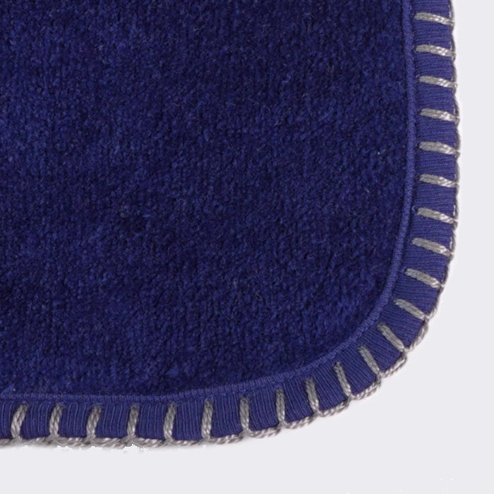Close up of corner of a towel. Royal Blue towel with Birch color edge stiting.